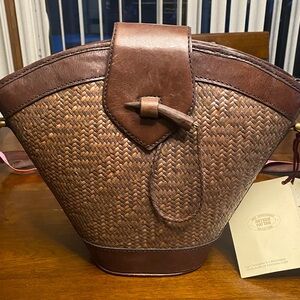 Brown leather-trimmed Rattan Shoulder Bag with shoulder strap 50 inches long.